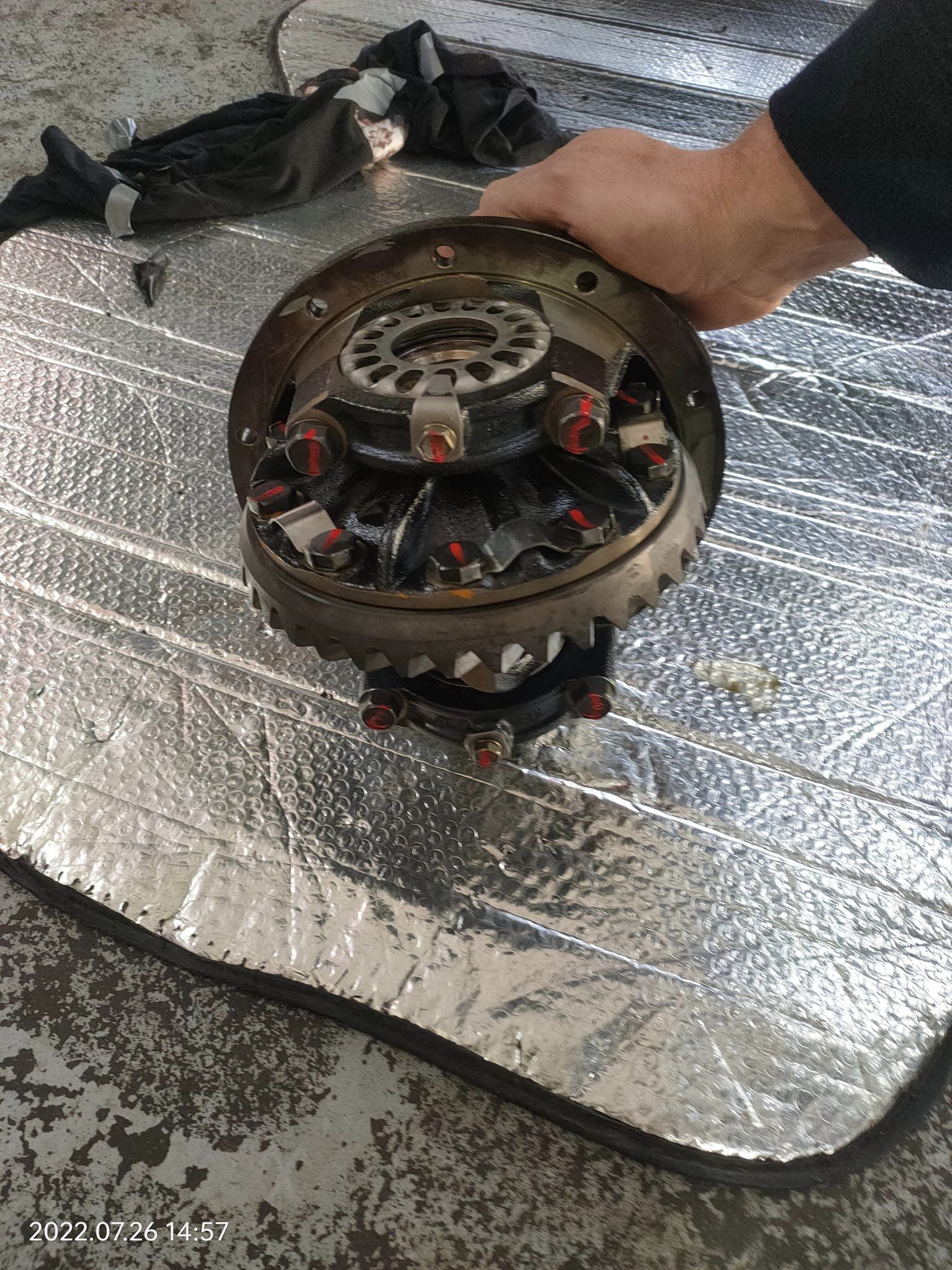 A clutch and flywheel assembly on the bench at Street Class Automotive
